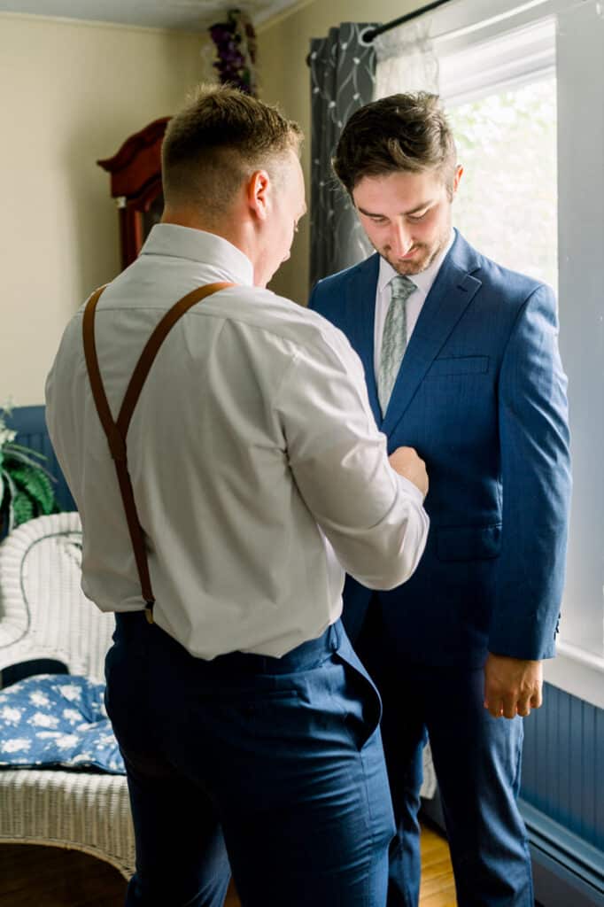 groom getting ready with best man