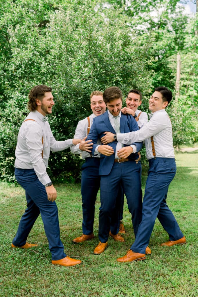 mohawk falls groomsmen group hug
