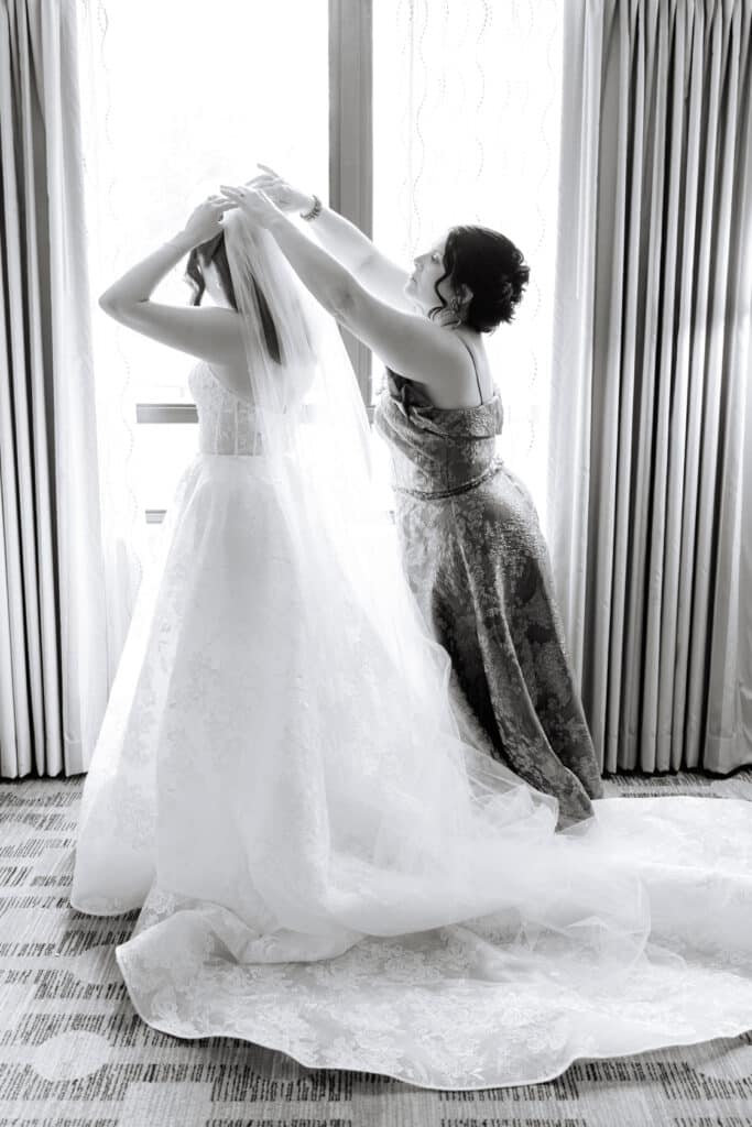 Sacred Heart Wedding Bride Getting Into Veil